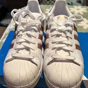 Rose gold Adidas Superstar shell toe basketball shoes
